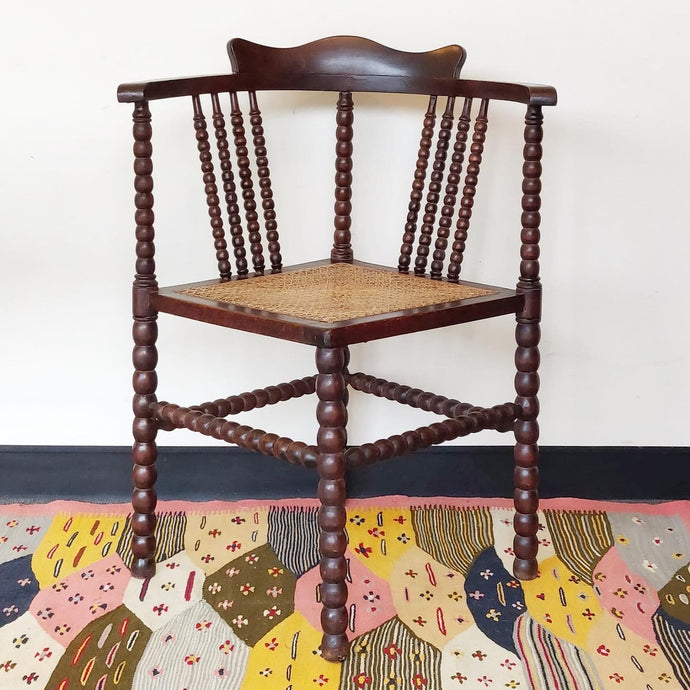 Antique hand turned corner bobbin chair with french cane seat