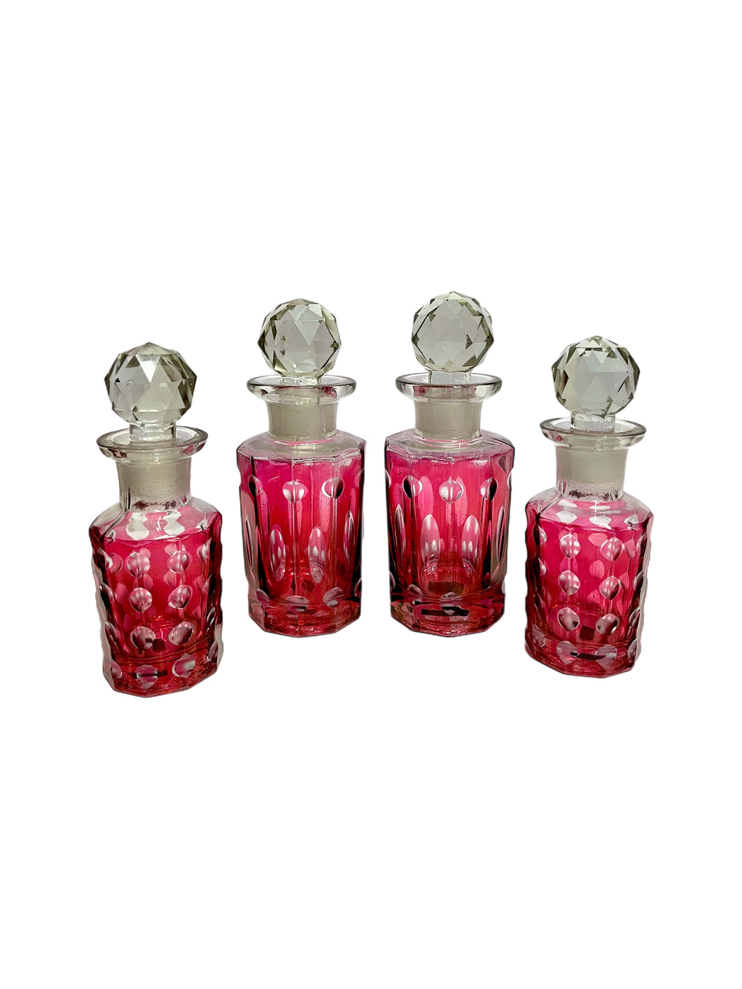 Vintage Set of Four Cranberry Decorative Glass Bottles